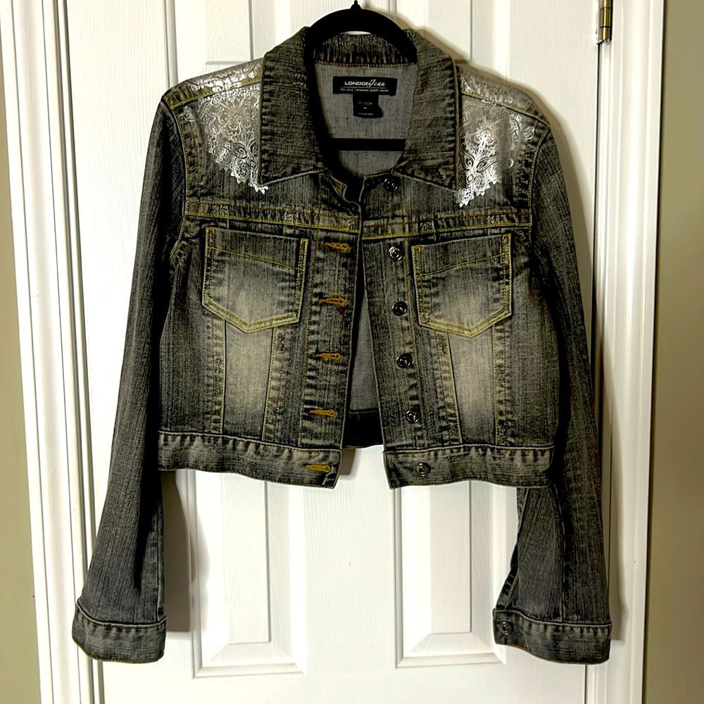 Cropped Jean jacket; good condition; lightly worn; distressed around the collar
